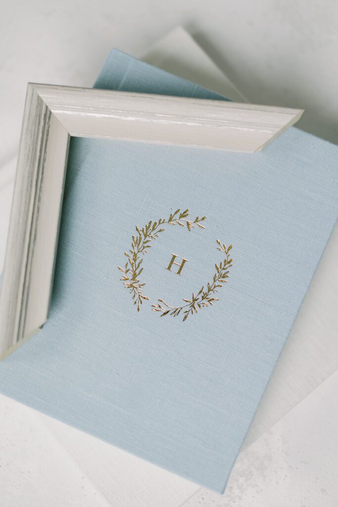 Debossed family album in light blue with frame corner set on top.