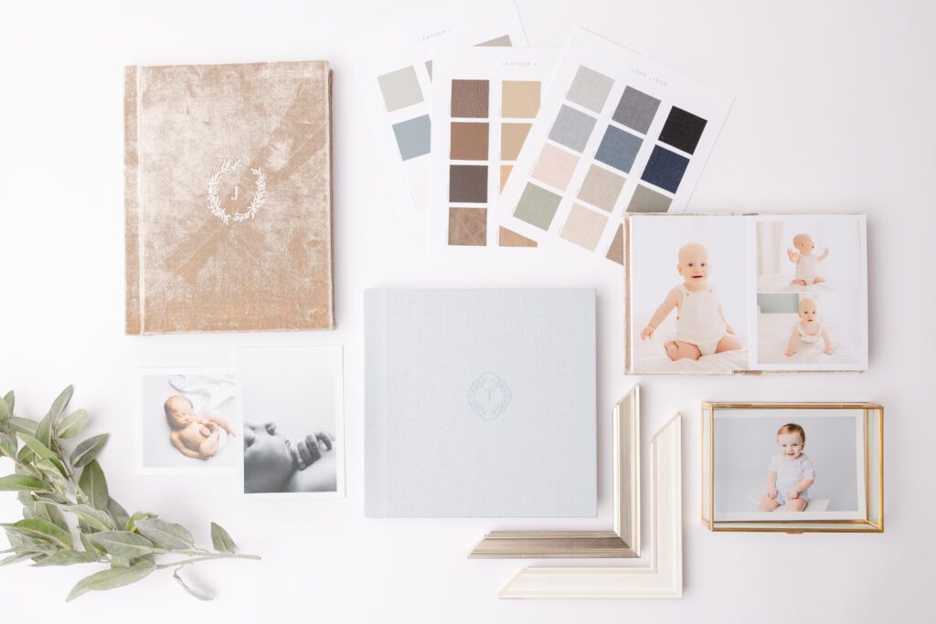 Flatlay image of albums, cover options, and printed portraits.