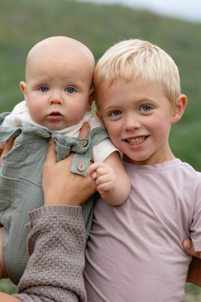 Portrait of two brothers smiling for the camera at family photos, Portland.