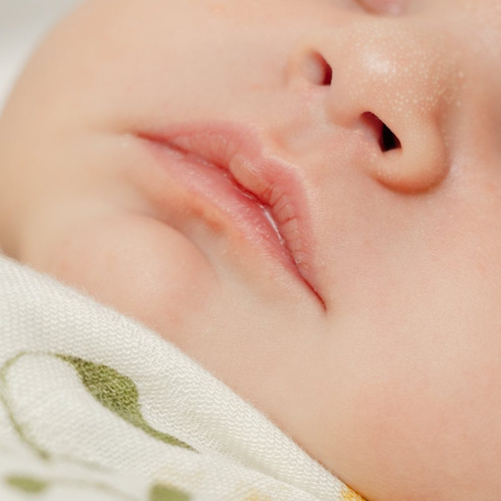 Detail shot of baby's lips for newborn photography Portland session.