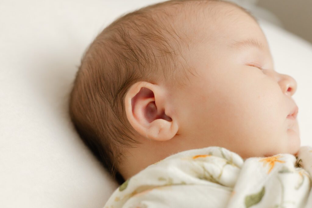 Detail shot of baby's ear for newborn photography Portland session.