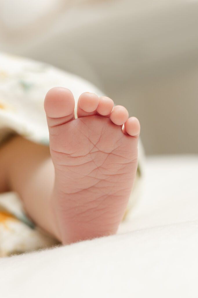 Detail shot of baby's foot for newborn photography Portland session.