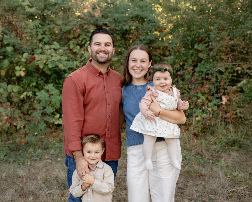 Smiling family portrait for this Portland lifestyle photographer's photoshoot in Champoeg State Park.